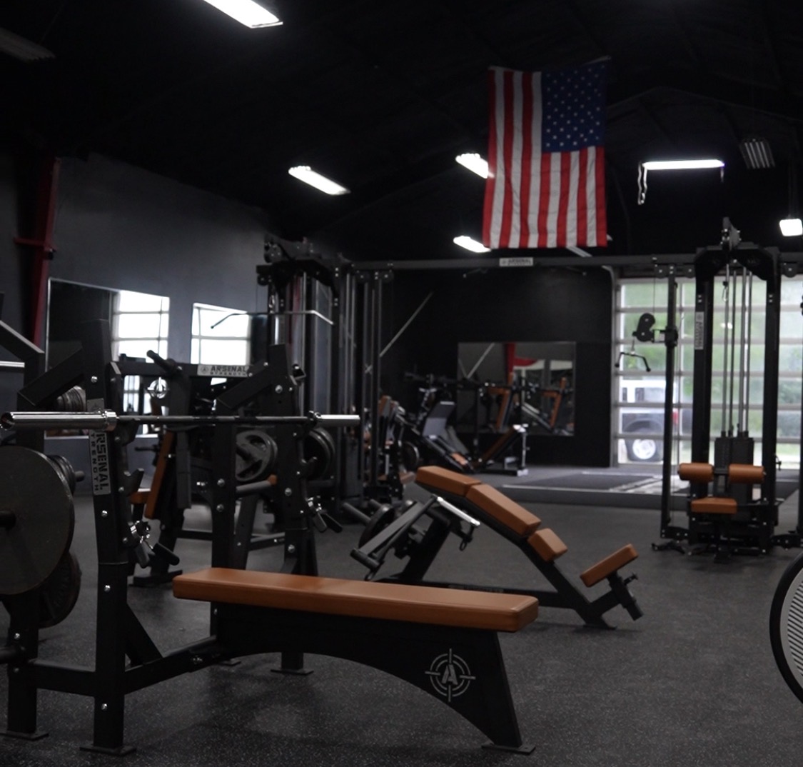 Strikeline training floor with Arsenal Strength equipment and an American flag